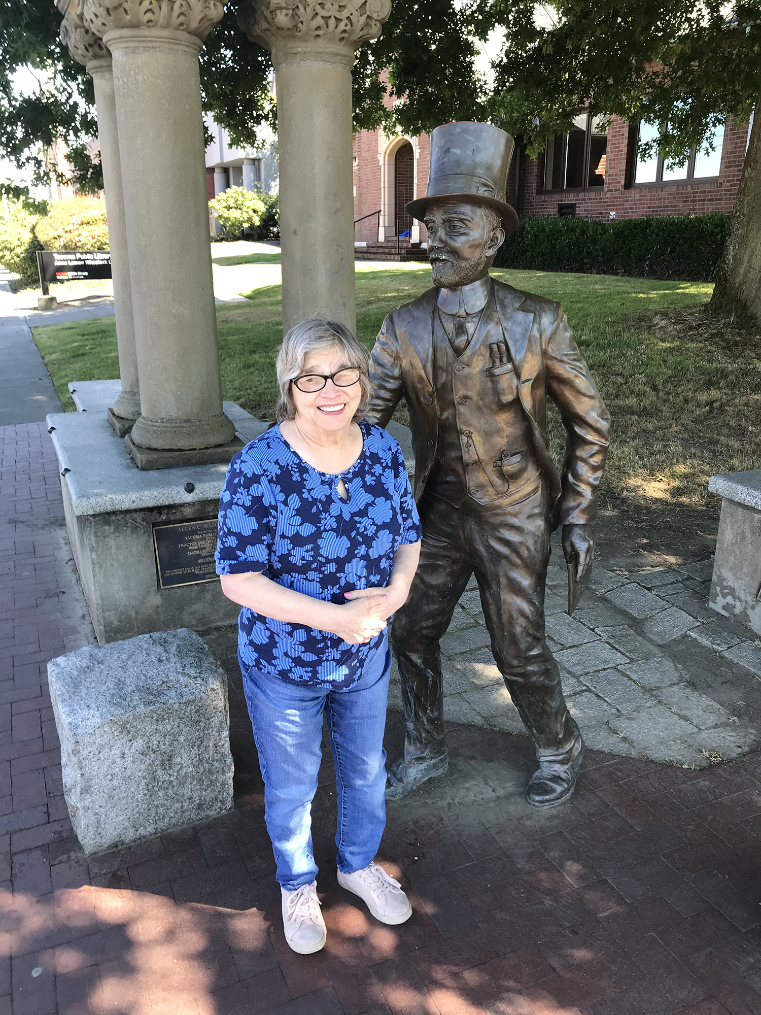 Sharilynn in front of the Allen C. Mason statue in the Proctor District