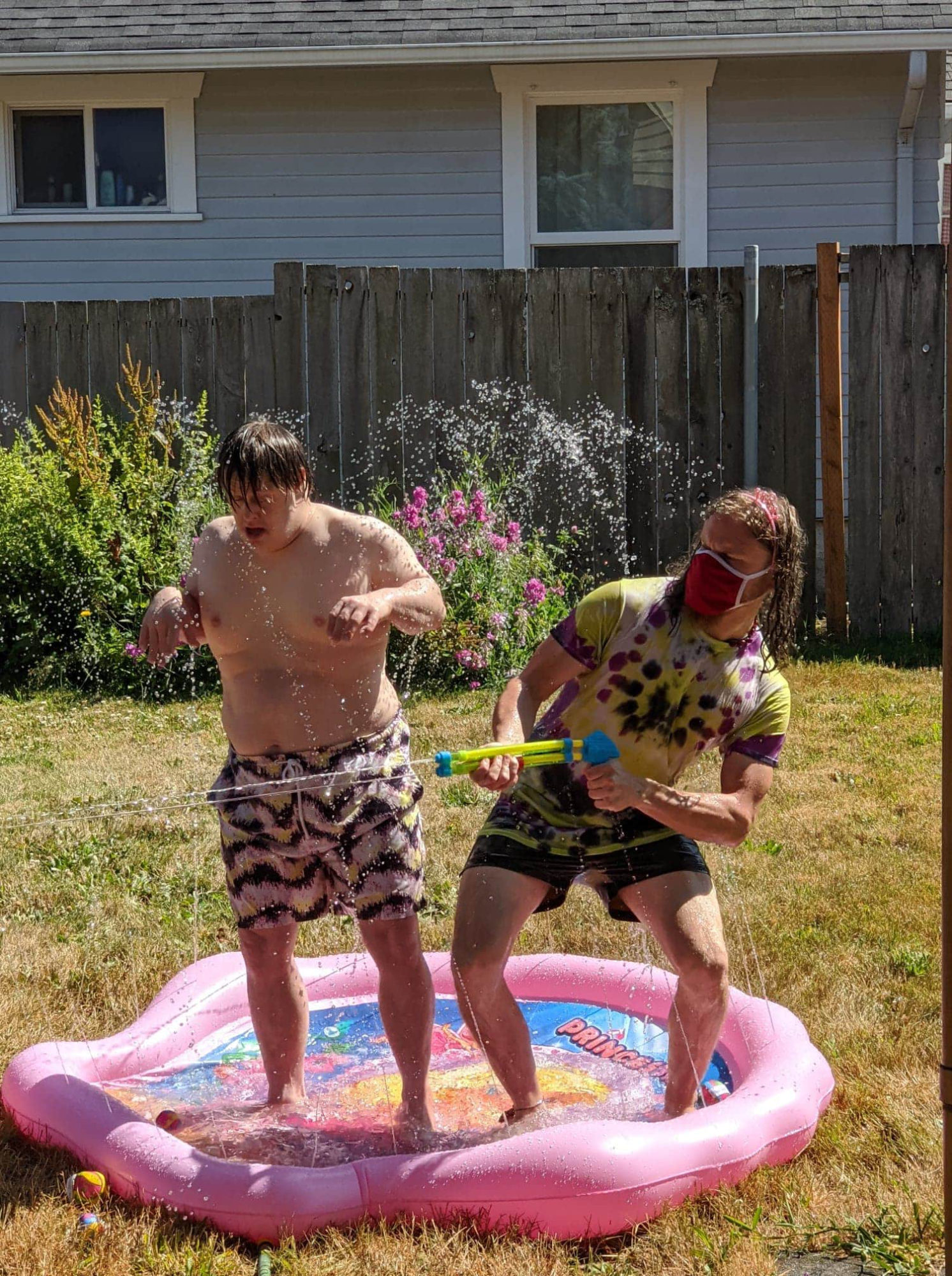 Nathan and Marvin playing in water.